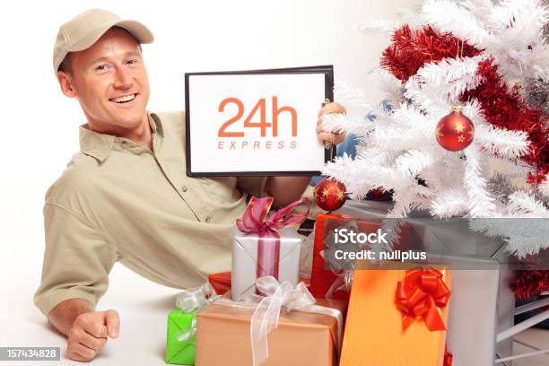 24 Hour Express Delivery Even On Christmas Stock Photo - Download Image Now - Blue-collar Worker, Christmas Tree, 24 Hrs