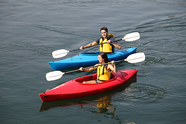 istock Couple Kayaking On The River 157434838