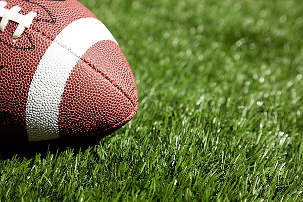 football on turf stock photo