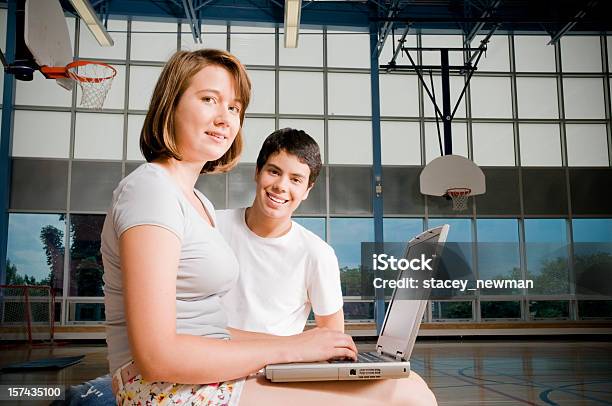 Teenaged Students On Laptop Stock Photo - Download Image Now - School Gymnasium, Laptop, Student