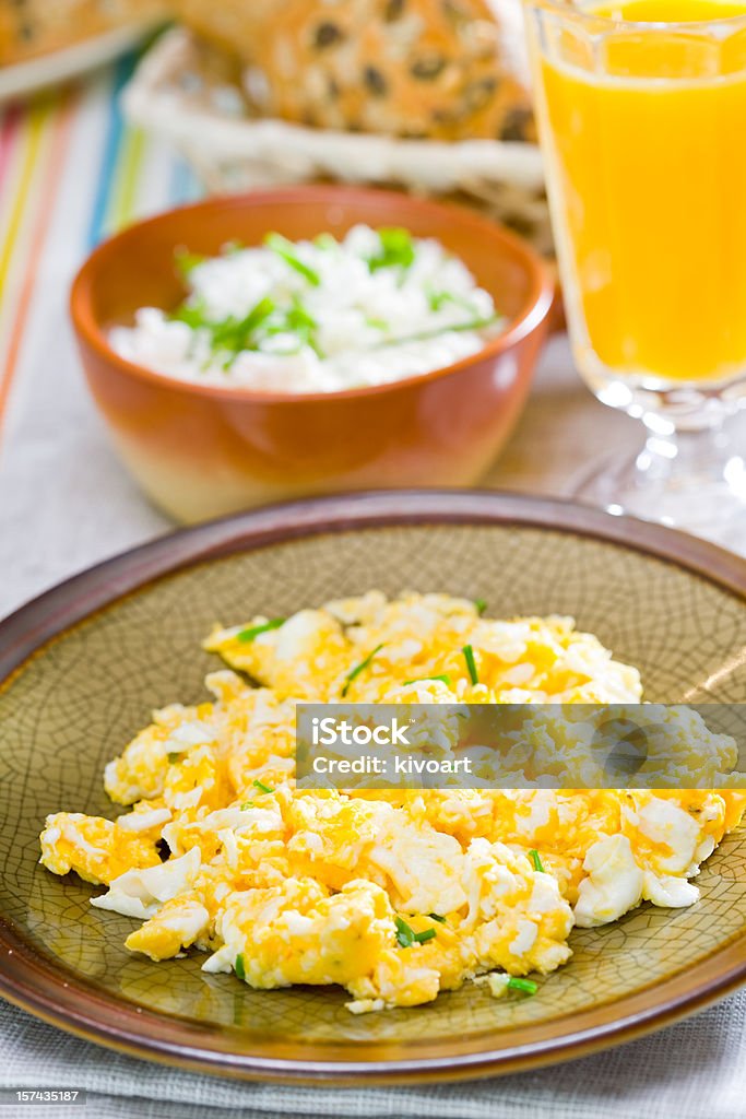 Scrambled egg breakfast: scrambled egg, orange juice and ricotta cheese Scrambled Eggs Stock Photo