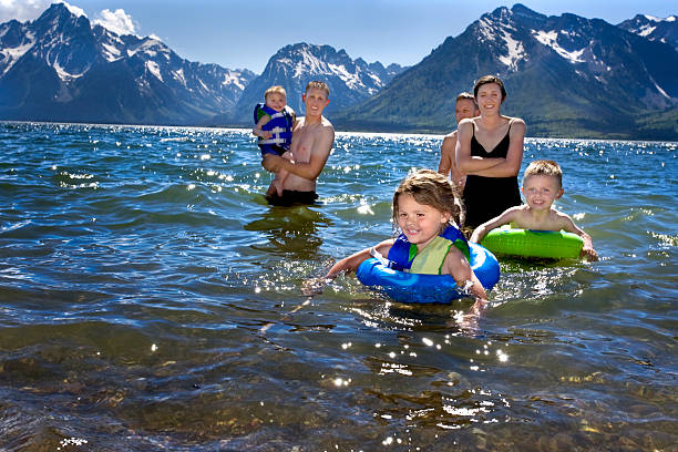 young woman splashing water while swimming