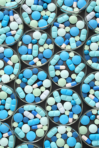 istock Pills in petri dishes 157435571