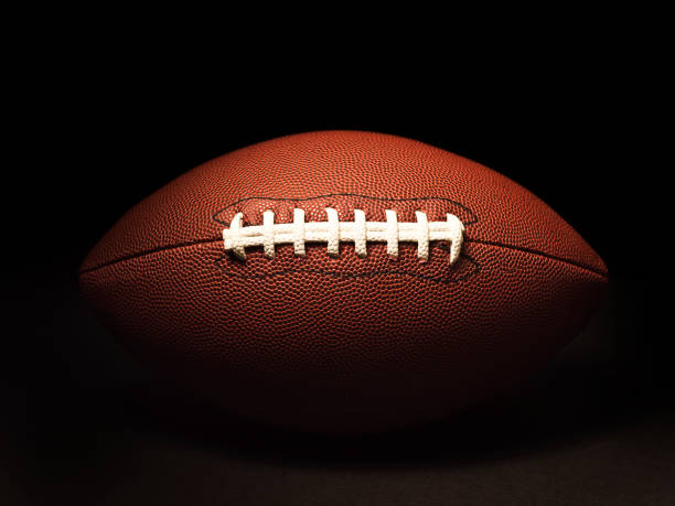 istock American football on black 157435802