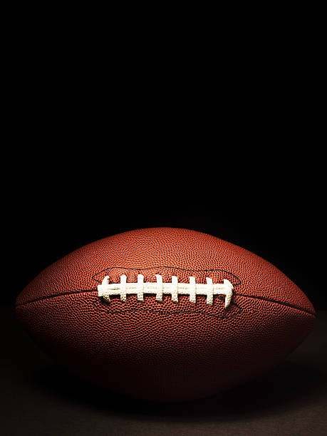 istock American football on black 157435803