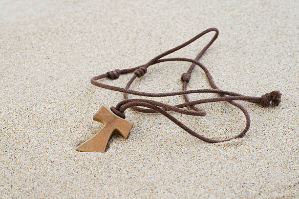 Tau cross in the sand  st anthony of padua stock pictures, royalty-free photos & images