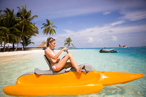 Woman in paddle boat  pedal boat stock pictures, royalty-free photos & images