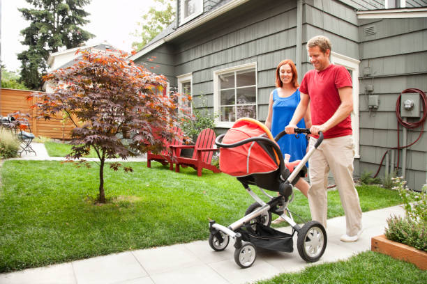 istock Young Family Leaving Home with Baby Stroller 157436571