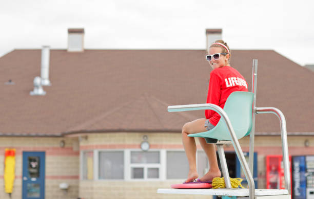 Lifeguard on Duty Female lifeguard at work Lifeguard stock pictures, royalty-free photos & images