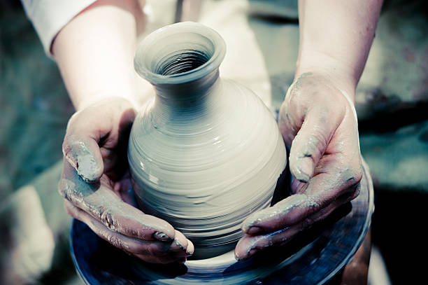 istock potter makes a jug out of clay 157436706