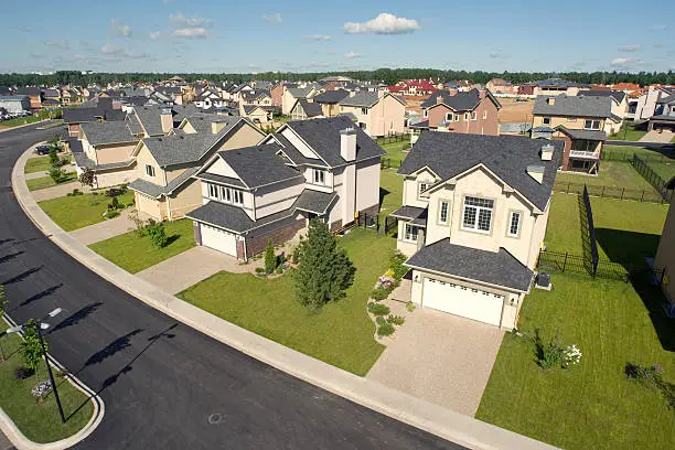 High angle view of several suburban houses in sunny summer afternoon.