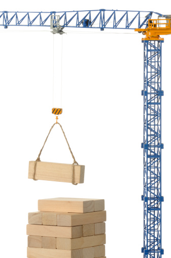 Building a wooden tower with a crane winch. 