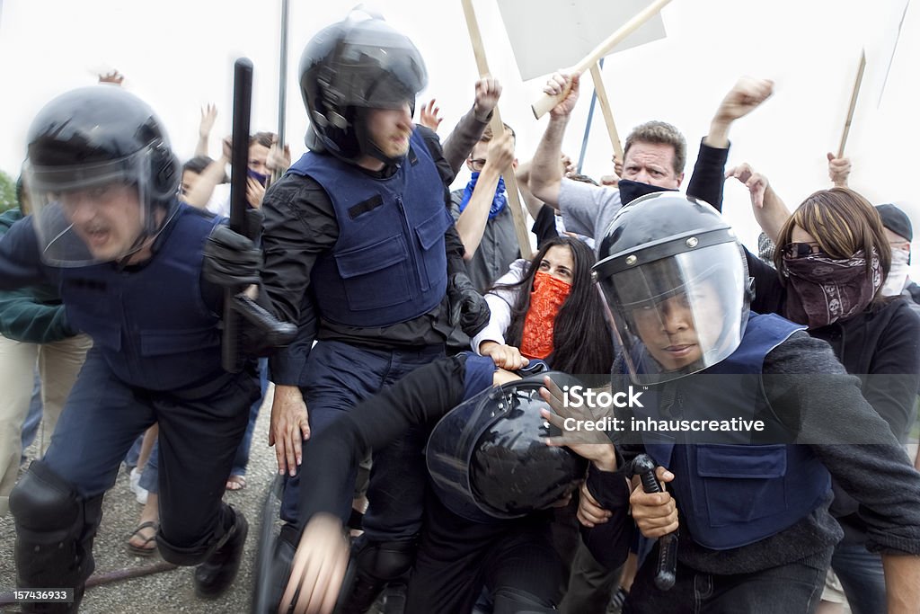 Riot Police Fight Angry Mob Riot Police Fight Angry Mob. This stock image has a horizontal composition. Riot Stock Photo