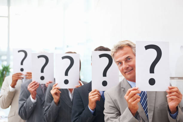 istock Business people in row holding question mark sign 157436962