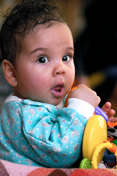 istock Baby Girl age 6 months old Playing 157436976