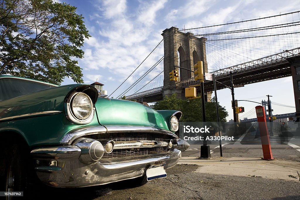 Classic car with view of Brooklyn Bridge Old car in a scene from Brooklyn, New York with the Brooklyn Bridge in the back ground. Brooklyn - New York Stock Photo