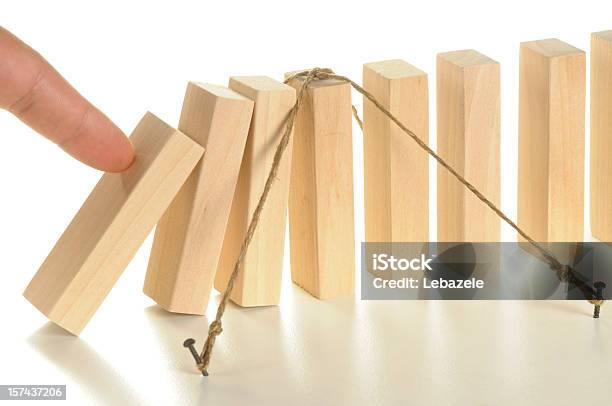 Illustration Using Tethered Wooden Dominos For Insurance Stock Photo - Download Image Now