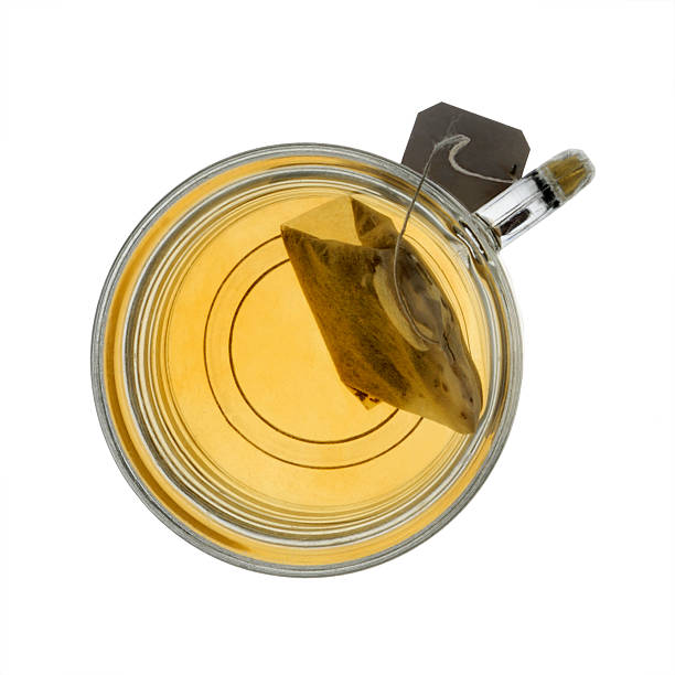 Glass Mug Teacup and Steeping Tea Bag stock photo