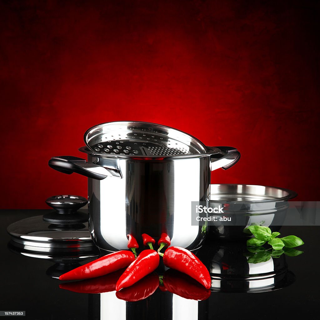 Red hot chilli peppers  Basil Stock Photo