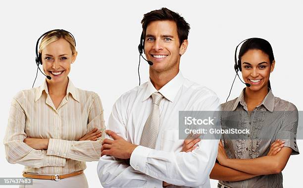 Happy Business Executives Wearing Headsets Stock Photo - Download Image Now - White Background, Call Center, Customer Service Representative