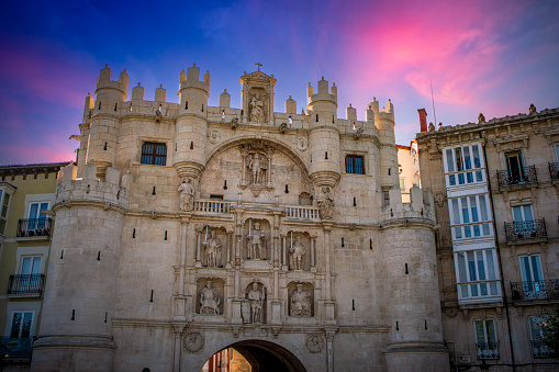 Medieval and monumental arch of Santa Maria in the historic city of Burgos, Castilla y Leon, Spain at sunset