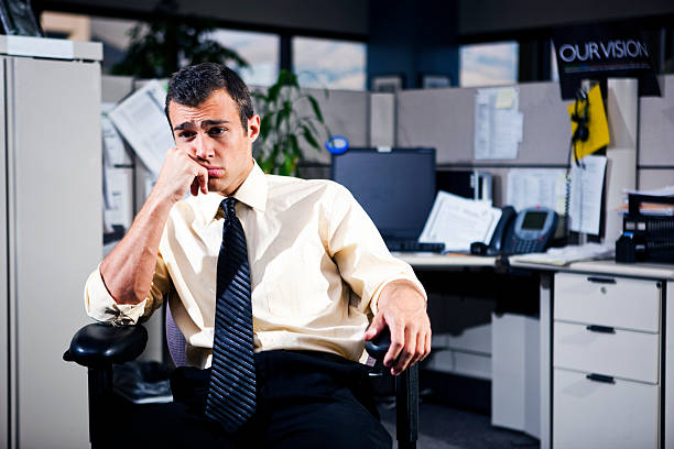 Depressed man working in the office Depressed man working in the office wasting time stock pictures, royalty-free photos & images