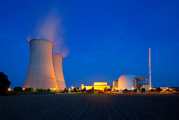 Nuclear Power Station At Night  nuclear energy stock pictures, royalty-free photos & images