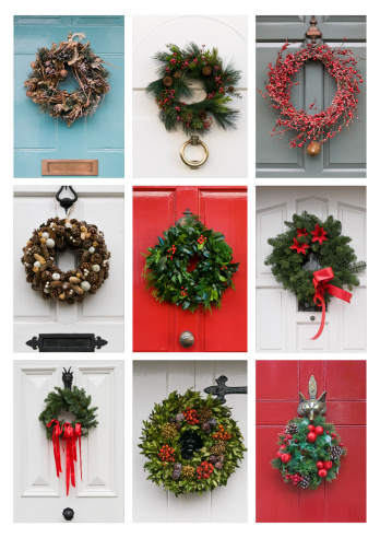A collection of traditional Christmas Wreaths on doors in Hertfordshire, England