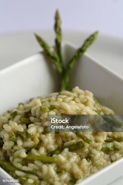 Risotto With Asparagus In A White Square Plate Stock Photo - Download Image Now - Asparagus, Risotto, Carbohydrate - Food Type