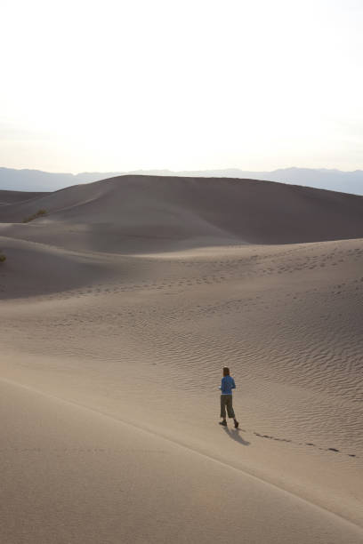 istock Woman wandering in the desert 157439595