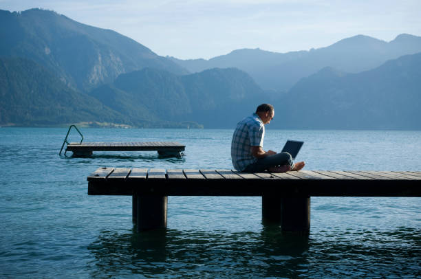 istock Man on a jetty working outdoor 157439927