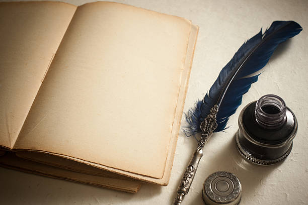 istock Quill pen, inkwell  and old book 157439979