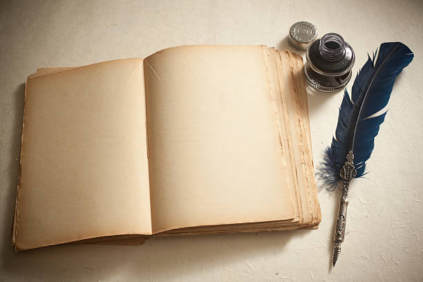 istock Quill pen, inkwell  and old book 157439983