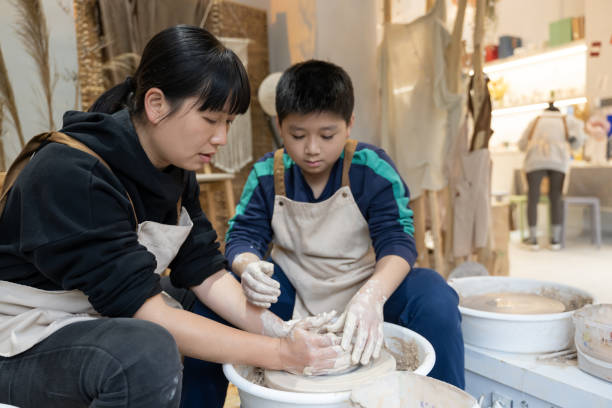 istock A woman and a little boy are making handmade pottery 1574401386