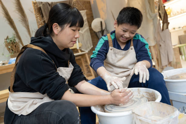 istock A woman and a little boy are making handmade pottery 1574401391