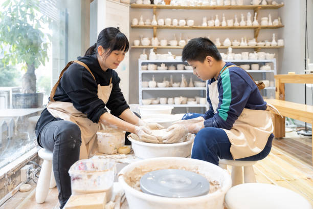 istock A woman and her son are interacting to make handmade pottery 1574401398