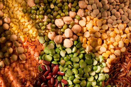 Assorted bean, pea and grain background. Green Peas, Soybean, Red Beans, Chick Peas,Brown Rice,Red Lentils, Green Lentils, Mung Beans. 