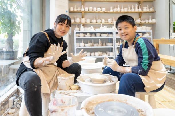 istock A woman and her son are interacting to make handmade pottery 1574401911