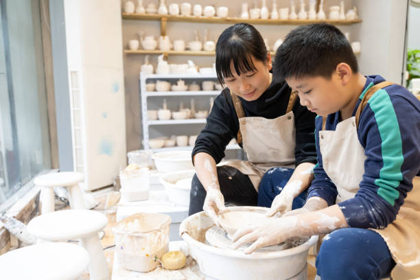 istock A woman and her son are interacting to make handmade pottery 1574402106