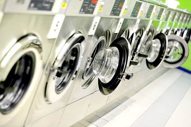 istock Washing machines in a public launderette 157440283