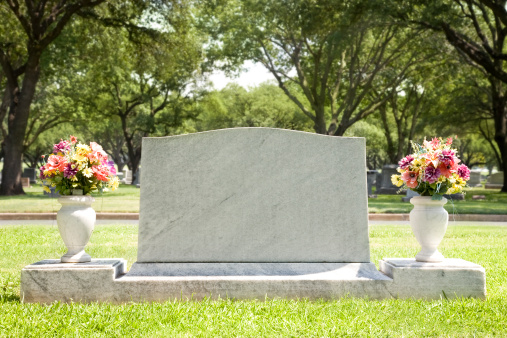 Blank Tombstone at Cemetery with Flowers