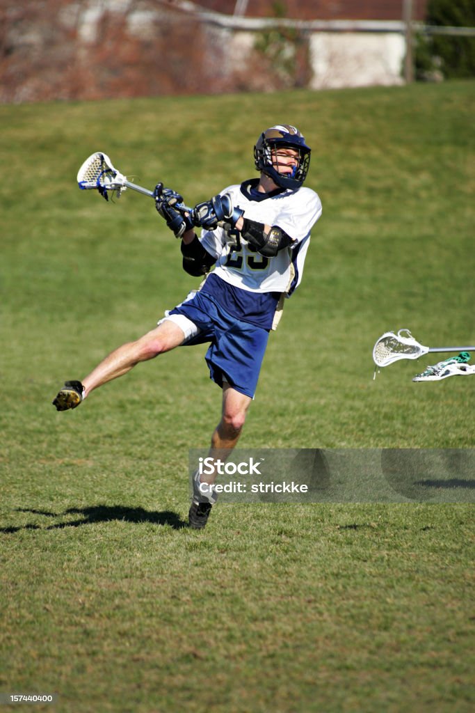 Masculino Jogador de Lacrosse saltos em um Chute a gol - Foto de stock de Lacrosse royalty-free