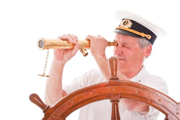 istock Senior sailor with telescope 157440455