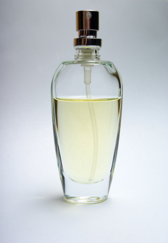 Bottle of perfume isolated on white