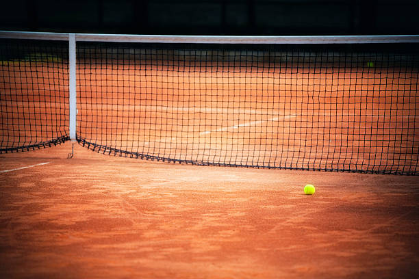 Tennis ball hitting hard the net
