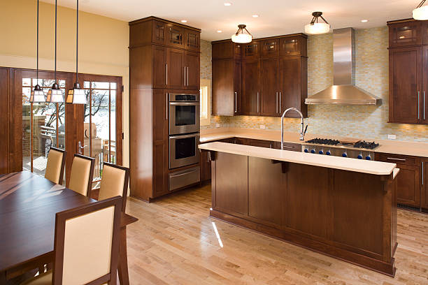 Modern residential kitchen with maple and stainless. stock photo