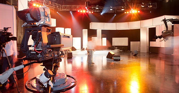 Empty television studio with camera stock photo