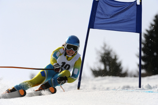Portrait of young female skier during giant slalom race