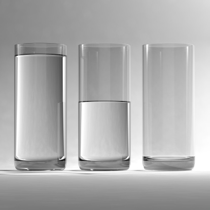 Full, half full and empty glasses of water. Very high resolution 3D render.