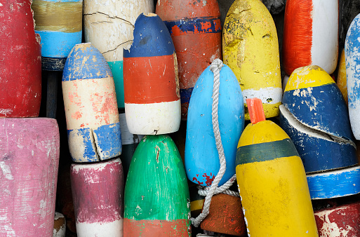 Close up of a group of colorful fishing buoys. More New England coast images in lightbox below...